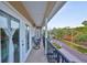 Relaxing outdoor balcony featuring comfortable seating and scenic neighborhood vistas at 6822 Kissimmee St # 8-B, Tampa, FL 33616