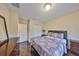 Charming bedroom with hardwood floors, closet and dresser, and a serene ambiance at 6822 Kissimmee St # 8-B, Tampa, FL 33616