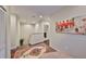 Hallway landing featuring a decorative rug, recessed lighting, and artwork on the wall at 6822 Kissimmee St # 8-B, Tampa, FL 33616