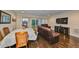 Bright and spacious living room with a comfortable leather sofa and outdoor view at 6822 Kissimmee St # 8-B, Tampa, FL 33616