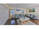 Comfortable living room with hardwood floors, light blue sofas, and an elegant coffee table at 6822 Kissimmee St # 8-B, Tampa, FL 33616