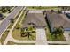 An aerial view of the house, highlighting its well-manicured lawn and landscaping at 7202 Ozello Trail Ave, Ruskin, FL 33573