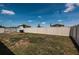 View of the backyard with a lush green lawn, and a fence surrounding the property at 7202 Ozello Trail Ave, Ruskin, FL 33573