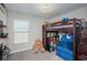 bedroom with a bunk bed, natural light and ample space for storage and play at 7202 Ozello Trail Ave, Ruskin, FL 33573