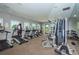 Bright fitness center with modern equipment, treadmills, and weight machines for a complete workout experience at 7202 Ozello Trail Ave, Ruskin, FL 33573