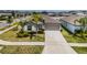 Well-maintained single-story home with beautiful landscaping and long driveway at 7202 Ozello Trail Ave, Ruskin, FL 33573