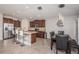 Open kitchen with granite countertops, stainless steel appliances, and a breakfast bar at 7202 Ozello Trail Ave, Ruskin, FL 33573
