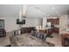 Spacious open-concept layout with a modern kitchen, sleek island, and comfortable living area at 7202 Ozello Trail Ave, Ruskin, FL 33573