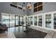 Grand lobby with elegant furnishings, tile floors, a modern chandelier, and inviting access to the pool area at 7202 Ozello Trail Ave, Ruskin, FL 33573