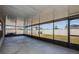 Enclosed patio offering a screened-in outdoor space with views of the backyard and surrounding neighborhood at 7202 Ozello Trail Ave, Ruskin, FL 33573