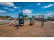 Community playground featuring a slide, climbing bars, and play equipment, perfect for families and outdoor fun at 7202 Ozello Trail Ave, Ruskin, FL 33573