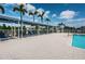 Poolside cabanas offer shaded seating and relaxation next to a sparkling swimming pool, perfect for a luxurious leisure at 7202 Ozello Trail Ave, Ruskin, FL 33573