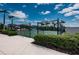 Community tennis court with a gated entrance, perfect for staying active and enjoying outdoor sports at 7202 Ozello Trail Ave, Ruskin, FL 33573