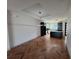 Bright living room featuring Herringbone floors, tray ceiling and recessed lights at 7208 N Glen Ave, Tampa, FL 33614