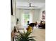 Open-concept living area with modern desk, stylish furniture, and ample natural light at 7208 N Glen Ave, Tampa, FL 33614
