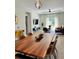 Stylish open-concept living and dining area with modern furnishings and plenty of natural light at 7208 N Glen Ave, Tampa, FL 33614