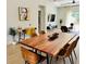 Bright open-concept living and dining area with stylish decor, modern furnishings and natural light at 7208 N Glen Ave, Tampa, FL 33614