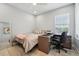 Clean bedroom with a desk, bed, and mirror that offers a comfortable and stylish space at 750 Sand Pine Ne Dr, St Petersburg, FL 33703