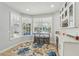 Bright breakfast nook with pool view, mini bar, and stylish decor at 750 Sand Pine Ne Dr, St Petersburg, FL 33703