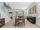 Dining room with chandelier, modern artwork, and staircase at 750 Sand Pine Ne Dr, St Petersburg, FL 33703