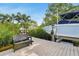 Dock with a boat lift and a chair at 750 Sand Pine Ne Dr, St Petersburg, FL 33703