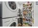 Well-organized pantry and laundry area with ample shelving and storage at 750 Sand Pine Ne Dr, St Petersburg, FL 33703