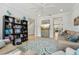 Spacious living room with ceiling fan, patterned rug, and stylish furniture at 750 Sand Pine Ne Dr, St Petersburg, FL 33703