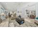 Sun-filled living room with open concept design, and access to dining room at 750 Sand Pine Ne Dr, St Petersburg, FL 33703