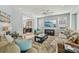 Sun-filled living room with open concept design, and access to dining room at 750 Sand Pine Ne Dr, St Petersburg, FL 33703