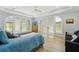 Spacious main bedroom featuring natural light, neutral decor, and sitting area at 750 Sand Pine Ne Dr, St Petersburg, FL 33703