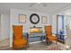 Relaxing seating area with vintage chairs, neutral walls, natural light, and hardwood floors at 7714 Bayleaf Dr, Hudson, FL 34667