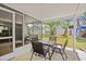 Dine al fresco on the patio with access to the screened porch and spacious backyard at 7714 Bayleaf Dr, Hudson, FL 34667