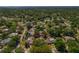 Overhead view of home's lot in residential neighborhood with private pool at 785 Hickory Ln, Palm Harbor, FL 34683