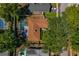 Bird's eye view of the property featuring mature trees, the roof, and a screened-in pool area at 785 Hickory Ln, Palm Harbor, FL 34683