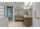 Bathroom features double vanity, framed mirror, and glass shower at 785 Hickory Ln, Palm Harbor, FL 34683