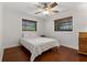 Charming bedroom with hardwood floors, lots of natural light and a ceiling fan at 785 Hickory Ln, Palm Harbor, FL 34683