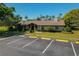 Community clubhouse offering amenities and gathering spaces, situated near ample parking and manicured lawns at 785 Hickory Ln, Palm Harbor, FL 34683