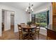 Breakfast nook features a sun-filled bay window with backyard views at 785 Hickory Ln, Palm Harbor, FL 34683