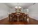 Elegant dining room with hardwood floors, chandelier lighting, and classic design at 785 Hickory Ln, Palm Harbor, FL 34683