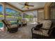 Relaxing screened lanai with comfortable seating overlooking the sparkling pool at 785 Hickory Ln, Palm Harbor, FL 34683