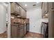 Laundry room features updated appliances, overhead cabinets, and a sink at 785 Hickory Ln, Palm Harbor, FL 34683