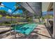 Beautiful backyard pool area with a screened enclosure for year-round enjoyment at 785 Hickory Ln, Palm Harbor, FL 34683