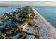 Expansive aerial view of beachfront home with private pool and access to a beautiful sandy beach at 8030 Manasota Key Rd, Englewood, FL 34223