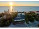 Stunning beachfront property with lush landscaping and panoramic ocean views at sunset at 8030 Manasota Key Rd, Englewood, FL 34223
