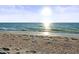 Sandy beach with turquoise water. Clear sky with bright sunlight shining down at 8030 Manasota Key Rd, Englewood, FL 34223