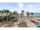 Expansive beachfront property with palm trees and access to the tranquil Gulf waters at 8030 Manasota Key Rd, Englewood, FL 34223