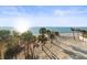 Beautiful view from beach access point of soft sand, calm water and blue sky at 8030 Manasota Key Rd, Englewood, FL 34223
