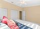 Comfortable bedroom featuring carpet, closet, and ceiling fan with light at 8030 Manasota Key Rd, Englewood, FL 34223