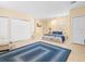 Bedroom showcasing tile flooring, an accent rug and direct outside access at 8030 Manasota Key Rd, Englewood, FL 34223