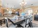 Dining room open to kitchen with seating for eight and bright, neutral decor at 8030 Manasota Key Rd, Englewood, FL 34223